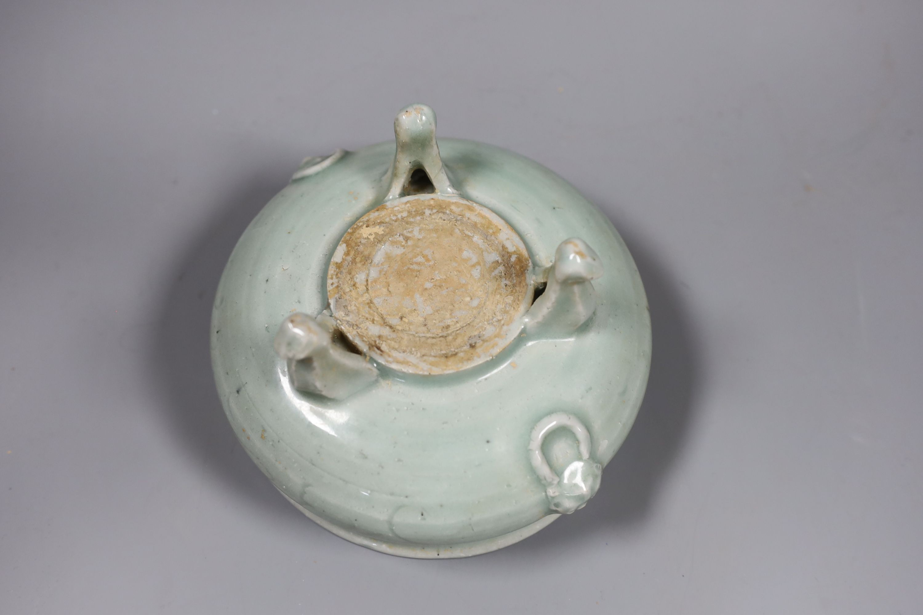 A Chinese celadon tripod censer, Ming or later, 16.5 cm diameter